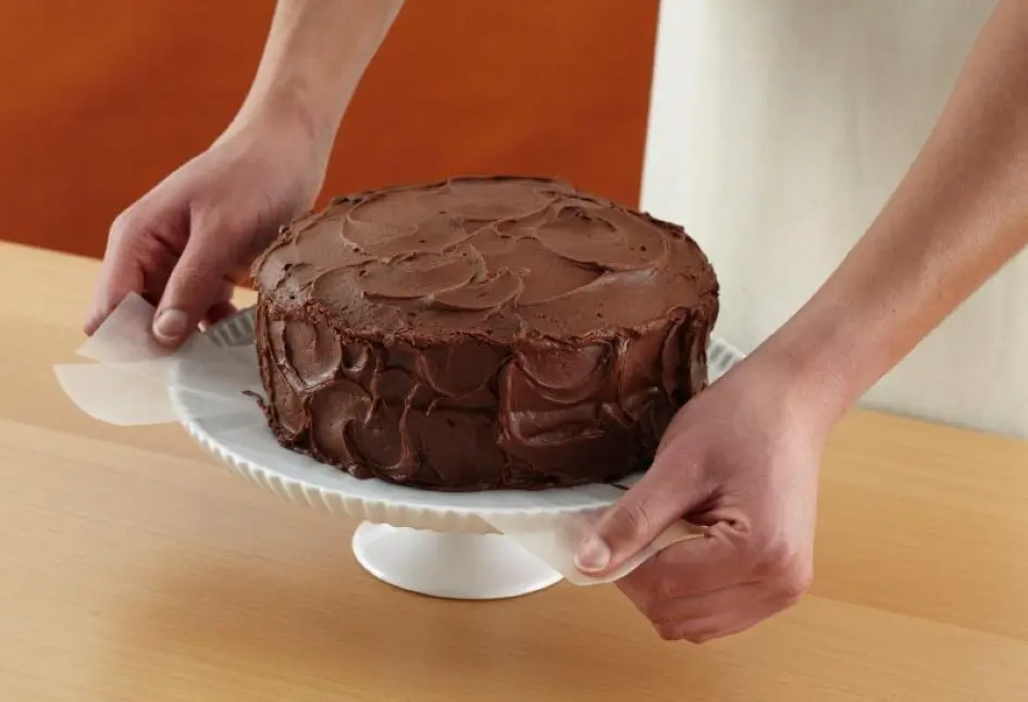 Tips for Making Cakes - Frosted cake with swirls on the side and a smooth layer of frosting on top, filling in the raised edges
